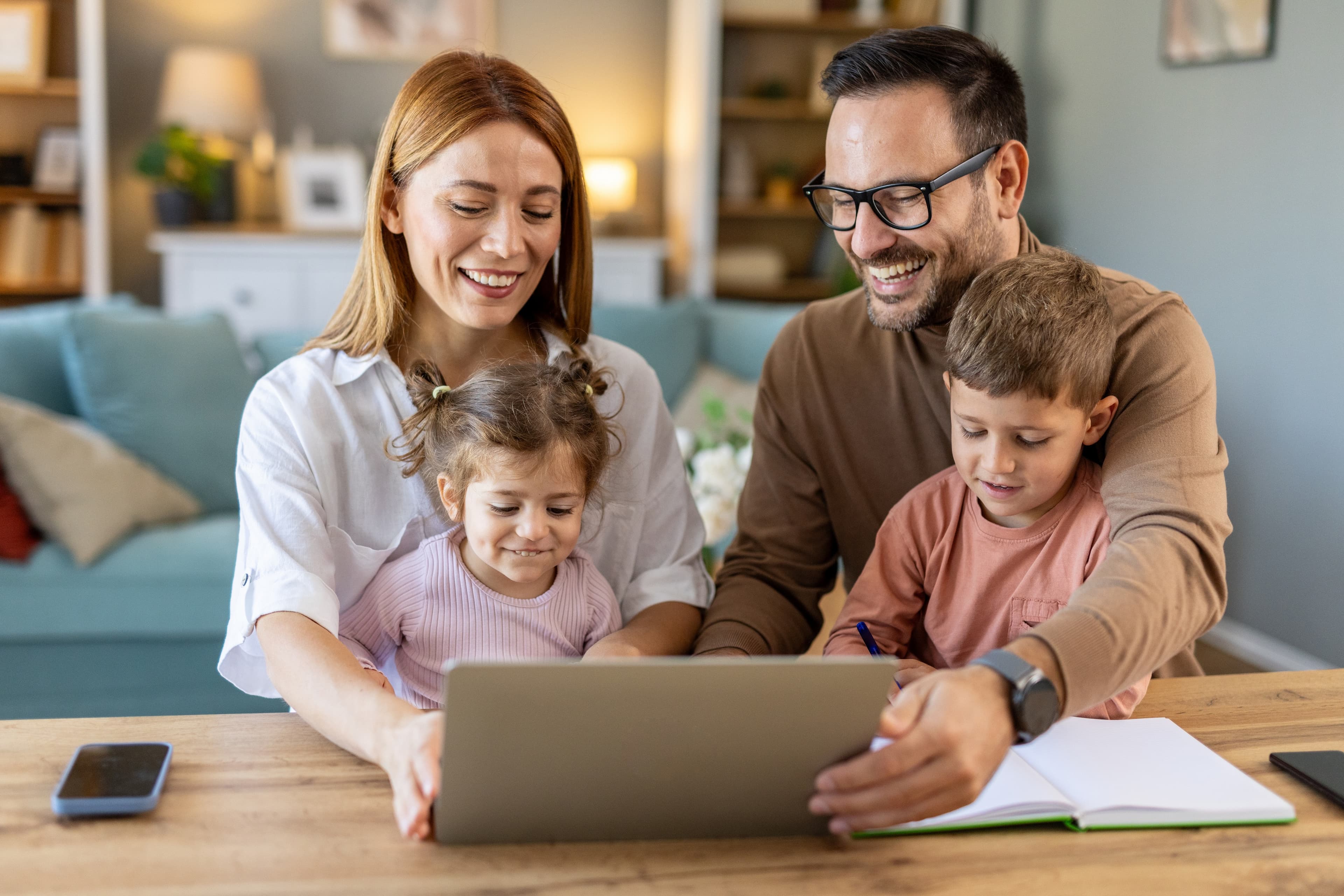 Family looking at home listings together